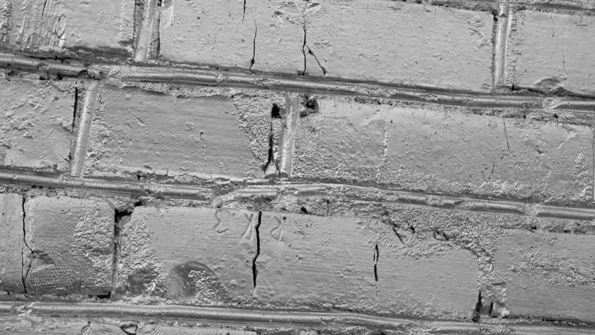 Loft of silver bricks background rotation close-up 4k. Bricklaying closeup. Clear place for your isolated text pattern. Empty space for your title copy space. Copyspace logo to blank design.