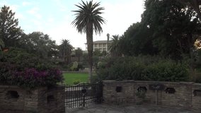 HD quality summer day video footage of the lush green historical Parliament gardens near Independence Museum located on a hill near city center of Windhoek, the capital of Namibia, southern Africa