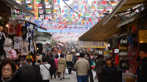 SEOUL, SOUTH KOREA - APRIL 16, 2012 Time Lapse of Seoul City Customers People Visit Busy Shopping Market Street Day