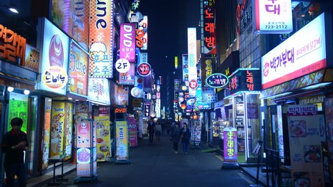 SEOUL, SOUTH KOREA - APRIL 16, 2012 Time Lapse of Seoul City Customers People Walking on Busy Shopping Street Night