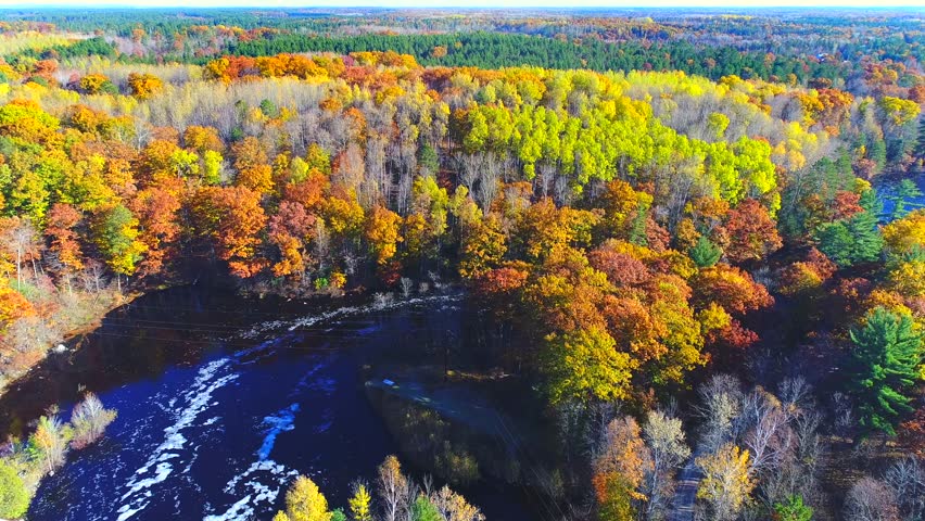Autumn in Northern Wisconsin, scenic drone view of amazing colorful forests along the Peshtigo River.