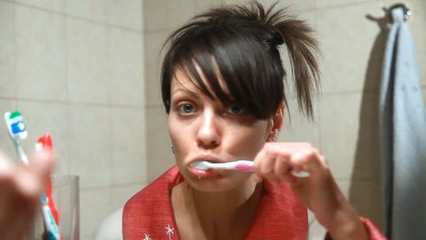 Woman brushes teeth Stock Video