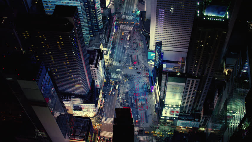 Top down aerial view of busy streets in downtown Manhattan in Times Square, New York City, with bright night lighting. Best New York vfx Aerial shot. Wide shot on 4k RED camera with green screens. Royalty-Free Stock Footage #1019337280