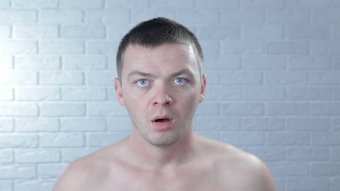 Embarrassed naked man Stock Video Footage - 4K and HD Video Clips