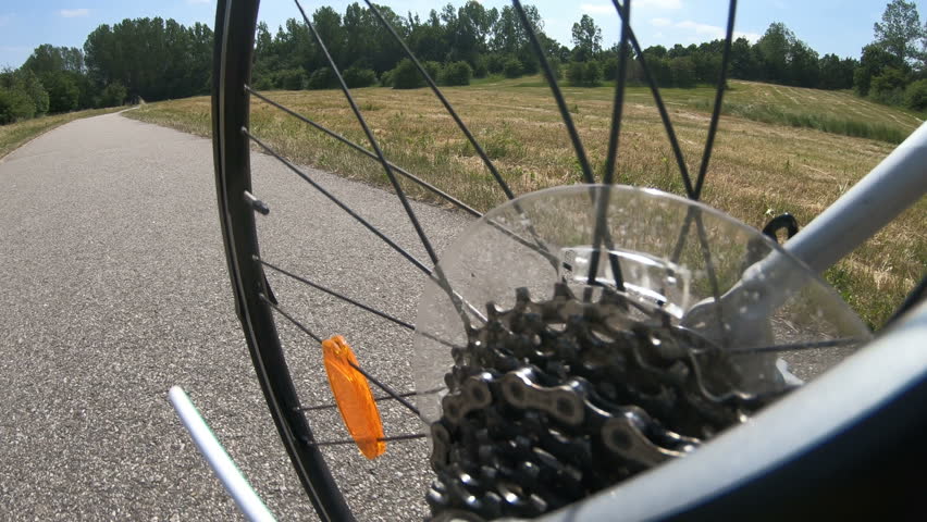 Low angle view of gear and wheeel of bicycle in movement
