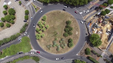 Fix drone vertical view over a roundabout in France. Traffic urban zone