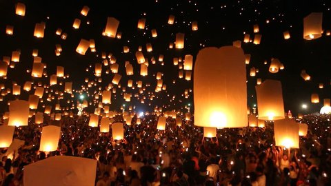 Many Sky Fire Lanterns Floating Up To The Sky In Yee Peng Lanna International Festival Travel Destinations Of Chiang Mai, Thailand (tilt up)