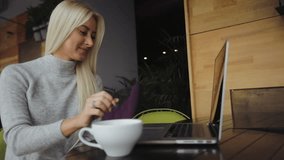 Study abroad, the student communicates with parents on the Internet. Cute young girl talking to a guy . International modern communication. Video in slow motion