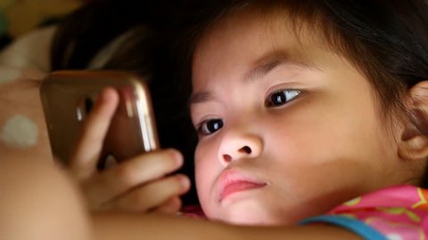 Thai  child  playing  smartphone