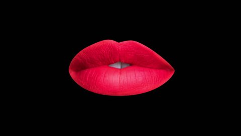 Time lapse sequence of woman's beautiful full red lips talking and moving against black background

