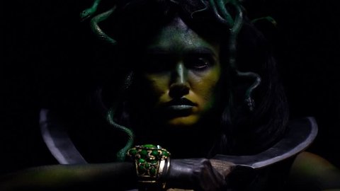 Gorgon Medusa swings her swords and lets out the battle cry