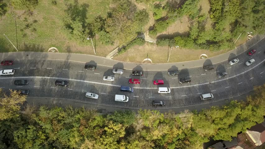 Fast moving footage - aerial top view of road automobile traffic of many cars, transportation concept. Shot in Kyiv, Ukraine | Shutterstock HD Video #1019422261