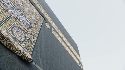 Circling around Kabaa - close up shot

written in Arabic:
"There is no god but Allah, Muhammad is the Messenger of Allah. "