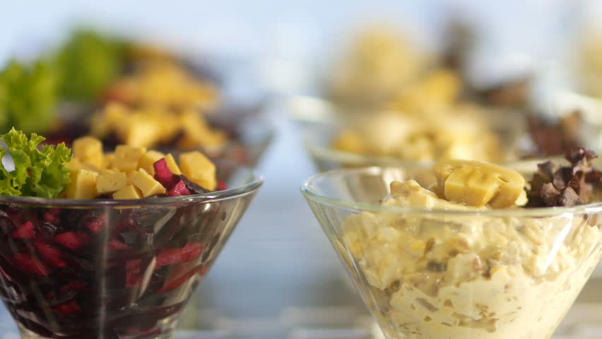 Tasty salad with vegetables and cheese in a fast food cafe. smooth focus