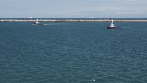 Tug boats standby for operations in harbor of port