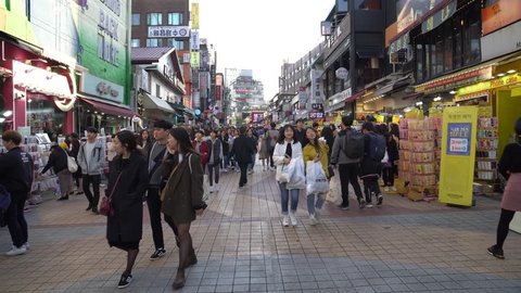 SEOUL, SOUTH KOREA - OCTOBER 21,2018 : Crowd of people in Hongdae(Hongik University) shopping street. Hongdae is a shopping cultural street for young people in Seoul.