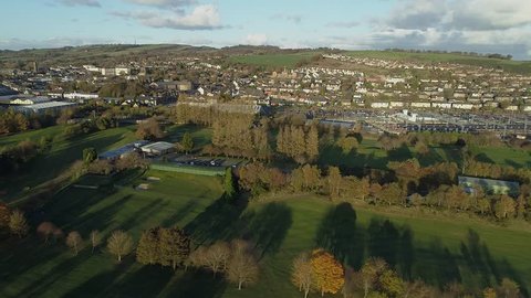 Aerial footage over the town of Bathgate in West Lothian, Scotland. Flying left.