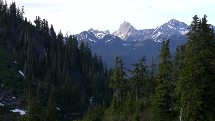 zoom out of american border peak and mount larabee at the north cascades of mt baker wilderness in the us pacific northwest