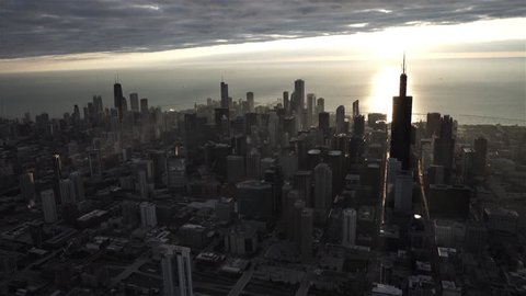 Chicago Circa-2015, aerial view of the Chicago Skyline at sunrise with Lake Michigan in the background, with sun rays coming off of the water and buildings