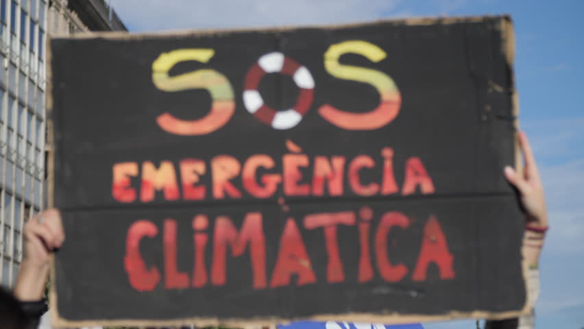 SOS Climatic Emergency in Catalan, on a Demonstration due to Climate Change. Royalty-Free Stock Footage #1019476507