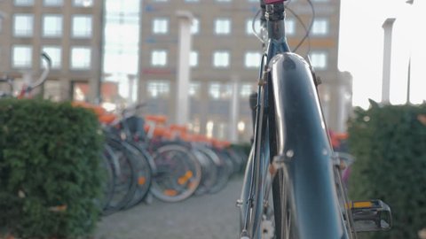 close-up of a man locking his bike with a u-lock