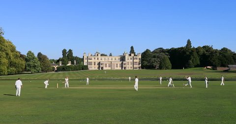 WALDEN, ENGLAND - 11 SEP 2018: Cricket match historic manor house England. 17th century country house. Historical tourist destination for classical beautiful architecture. Sport and recreation.