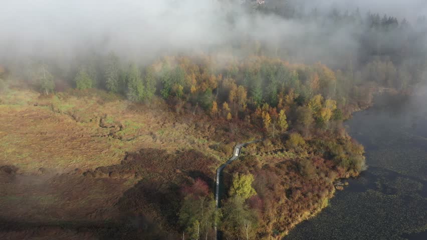 Beautiful mountain and forest lake in Vancouver, British Columbia, Canada. Drone flying aerial view. 4k.