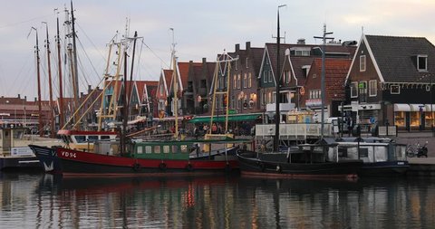 Volendam, Holland - October 2018: Boats and tourists in harbor