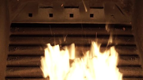 Flame iniside pellet biomass cauldron, Close up shot of flame, inside cauldron, wooden pellet biomass burning.