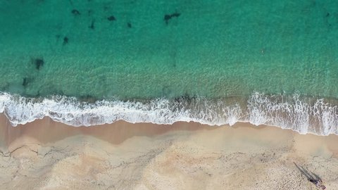 Aerial view of a beautiful beach bathed by a turquoise and transparent sea. Sardinia, Italy	