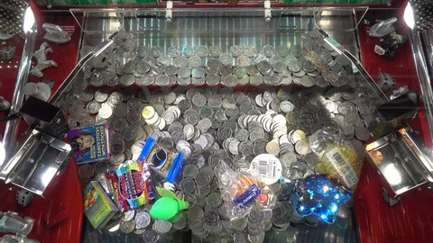 Brighton, England-24 October,2018: British coin pushing slot game machine at amusement arcade game Brighton Pier casino. Coin money game.