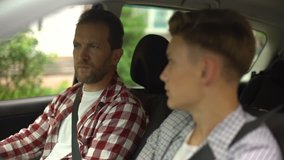 Male instructor teaching teenager to drive automobile, safety rules, close-up - Powered by Shutterstock - Get 15% off with code: PIKWIZARD15