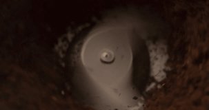 Coffee grinder mill finishing stopping to grind coffee beans close up macro shot Slow Motion top view video