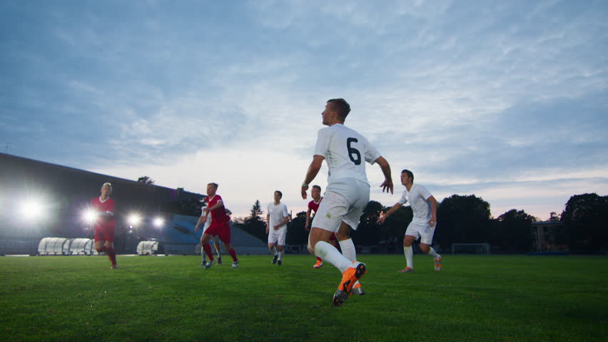 Soccer Player Receives Successful Pass and Kicks Ball and Scores Amazing Goal doing Bicycle Kick. In Slow Motion. Royalty-Free Stock Footage #1019537875
