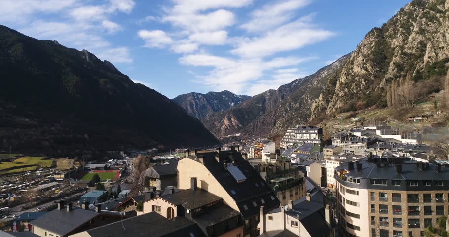 4k. Travel, drone view. Andorra. Europe. Sun shines over the summeries and blue sky. Little town between the mountains. Modern architecture Royalty-Free Stock Footage #1019546044