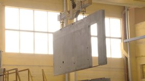 Bridge single girder crane moves the finished wall panel. Production of wall panels for frame housing construction.
 - Powered by Shutterstock - Get 15% off with code: PIKWIZARD15