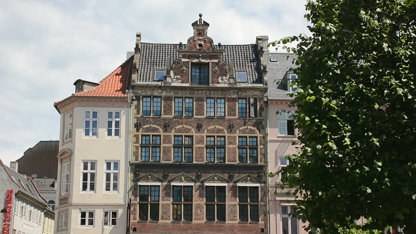 Old building facade in Stroget pedestrian zone, historic center of Copenhagen, Denmark