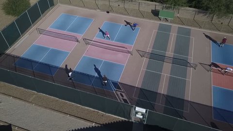 Aerial of active senior citizens playing pickleball