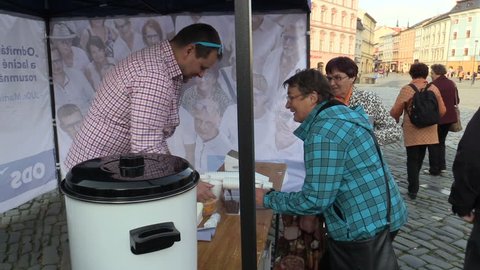 OLOMOUC, CZECH REPUBLIC, SEPTEMBER 2, 2018: The pre-election meeting of the Civic Democratic Party of ODS on square, people receive free-of-charge wine and sweets, discussing politics, policy election