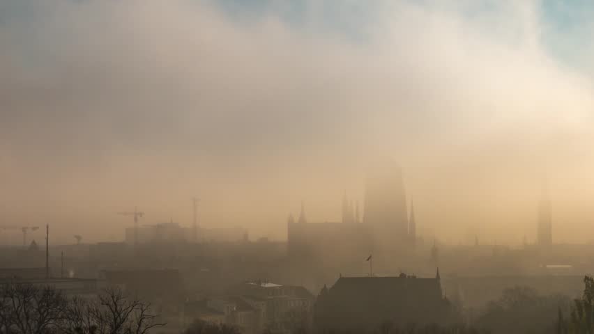 Time lapse. Foggy and cloudy cityscape of Gdansk with St. Mary