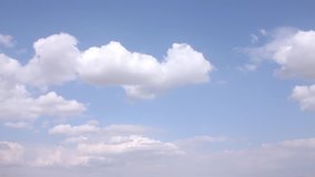 Time lapse clouds, nature. Fast motion white cloudscape in beautiful sunny day, real clean blue skies in panoramic.