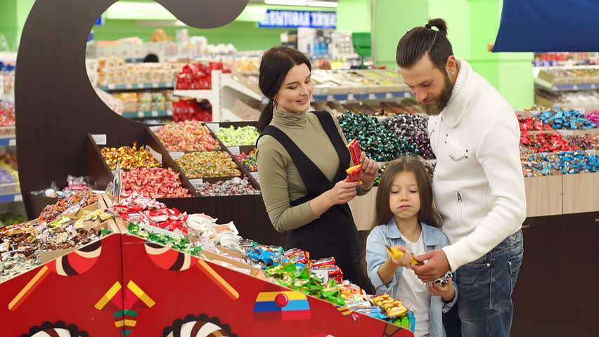 Young Parents Buy Candy for Stock 