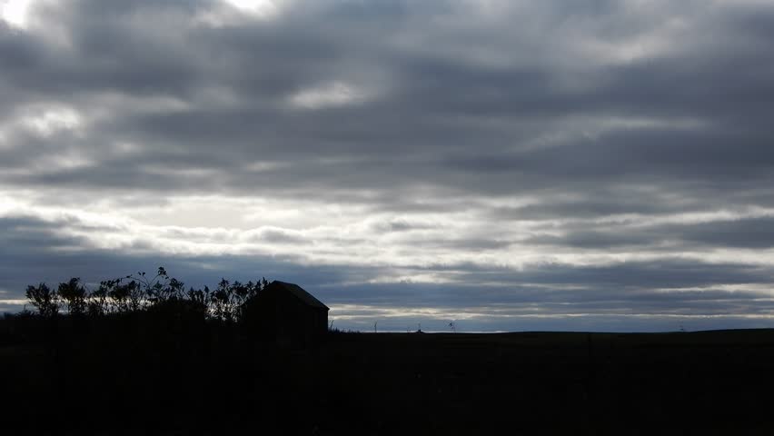 4K Farmhouse Trees Silouette Against Storm Cloudy Sky