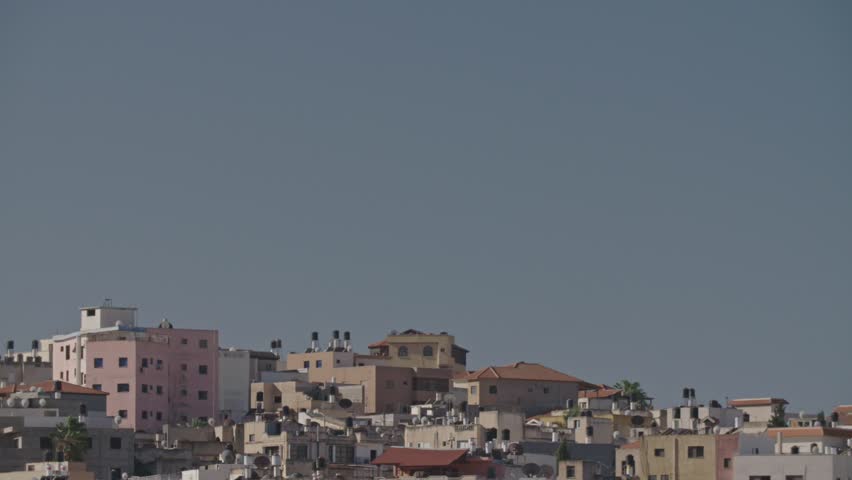 Overview of an Arab city in Israel with a large mosque rising above