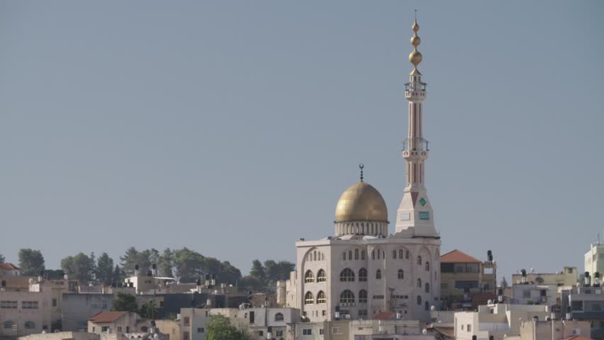 Overview of an Arab city in Israel with a large mosque rising above