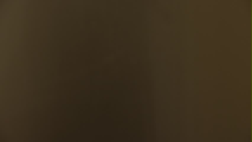 A man takes a refrigerator shelf saucer with honey, close-up