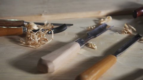 close up vintage carpentry tools for wood on a table with shavings