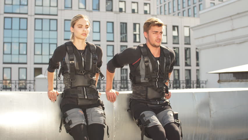 Two active people warming up before training. 