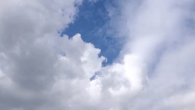 Blue soft clean skies in horizon, white time lapse rotating clouds in summer sunny day, formating fluffy, puffy cloudscape. 4K.