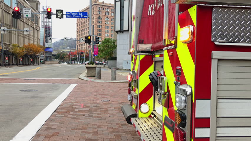 A fire truck parked on a Pittsburgh street with it